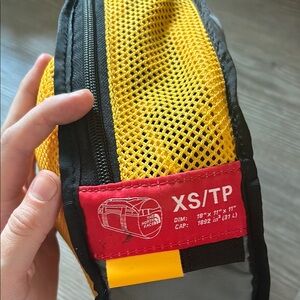 The North Face Yellow and Black duffel xs Bag